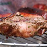 A juicy tenderly-cooked rump steak on a barbecue.