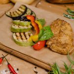 Photo of grilled vegetables and a chicken breast